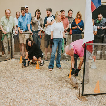 Attendees prepare for armadillo racing during a corporate event at Imagen Venues